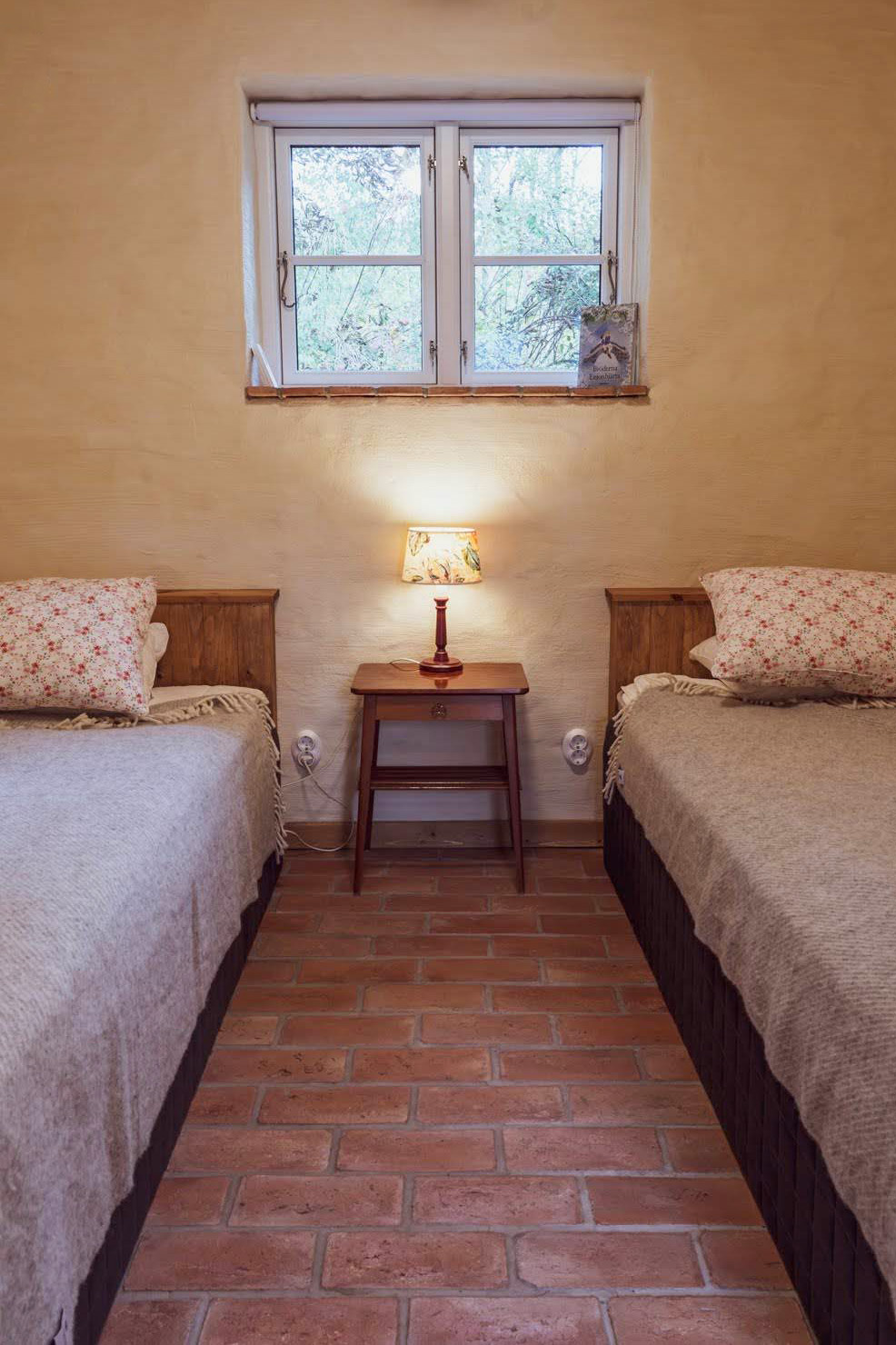 The small bedroom with two single beds.