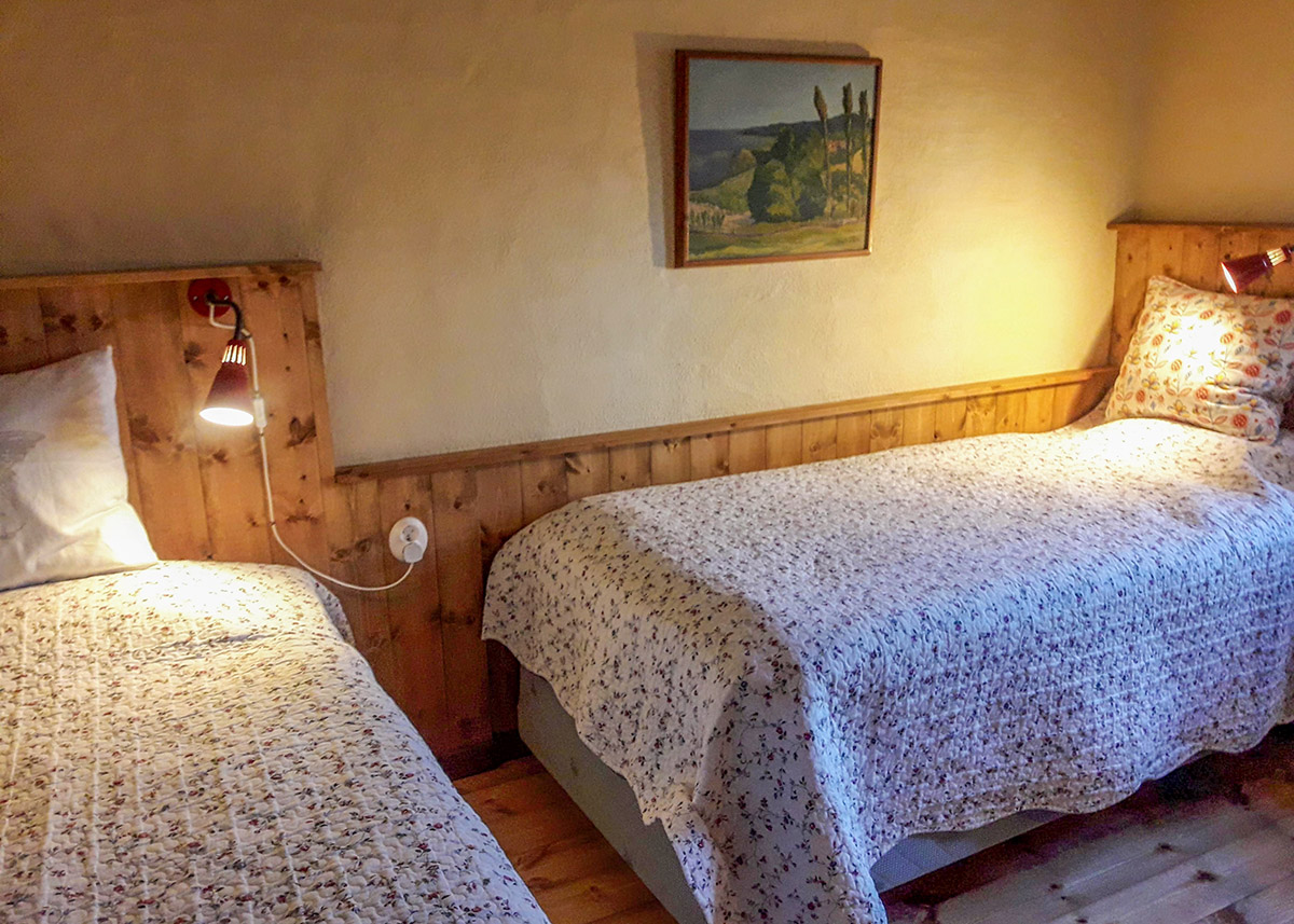 Bedroom with two of the six spring mattress beds in the big courtyard apartment.