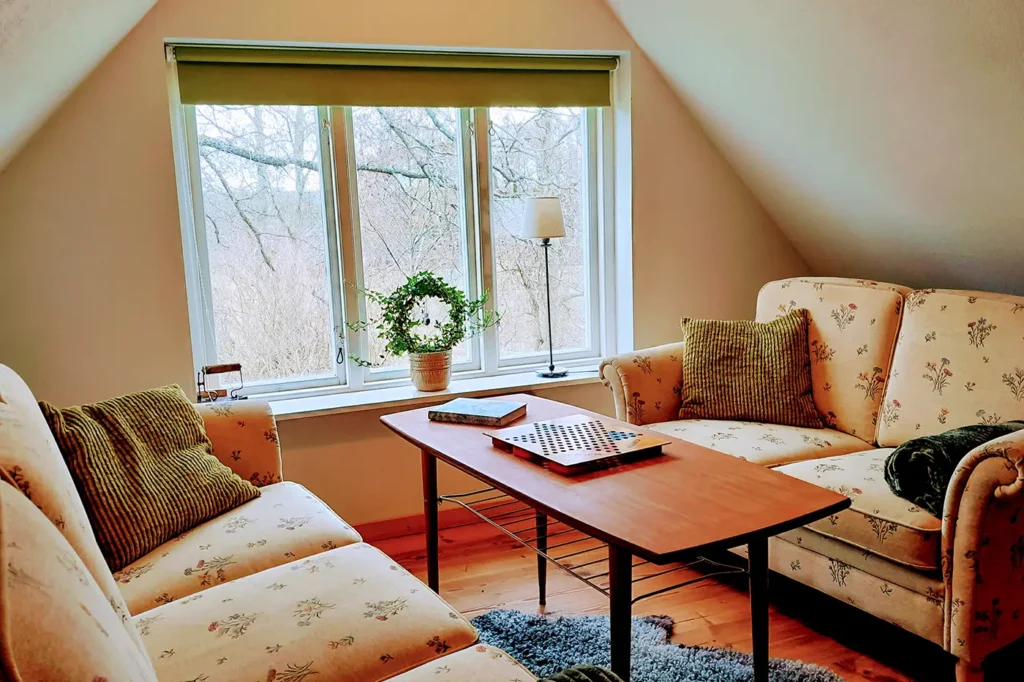The cozy corner at Loft with a view of orchards and the greenery of large oaks.