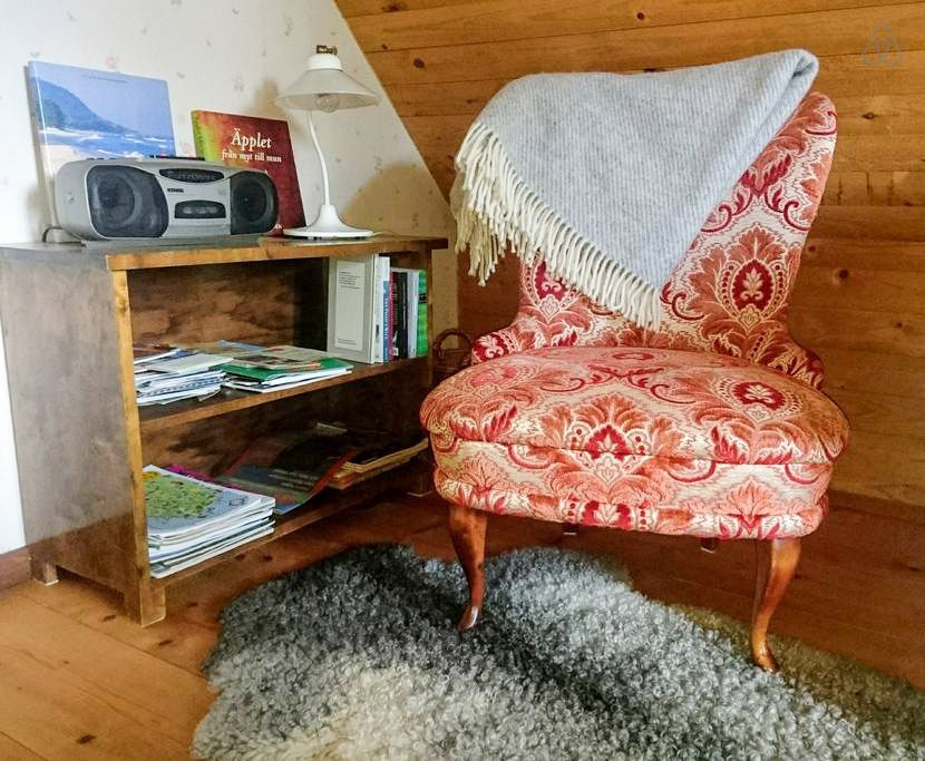 A cozy easy-chair for relaxed reading.