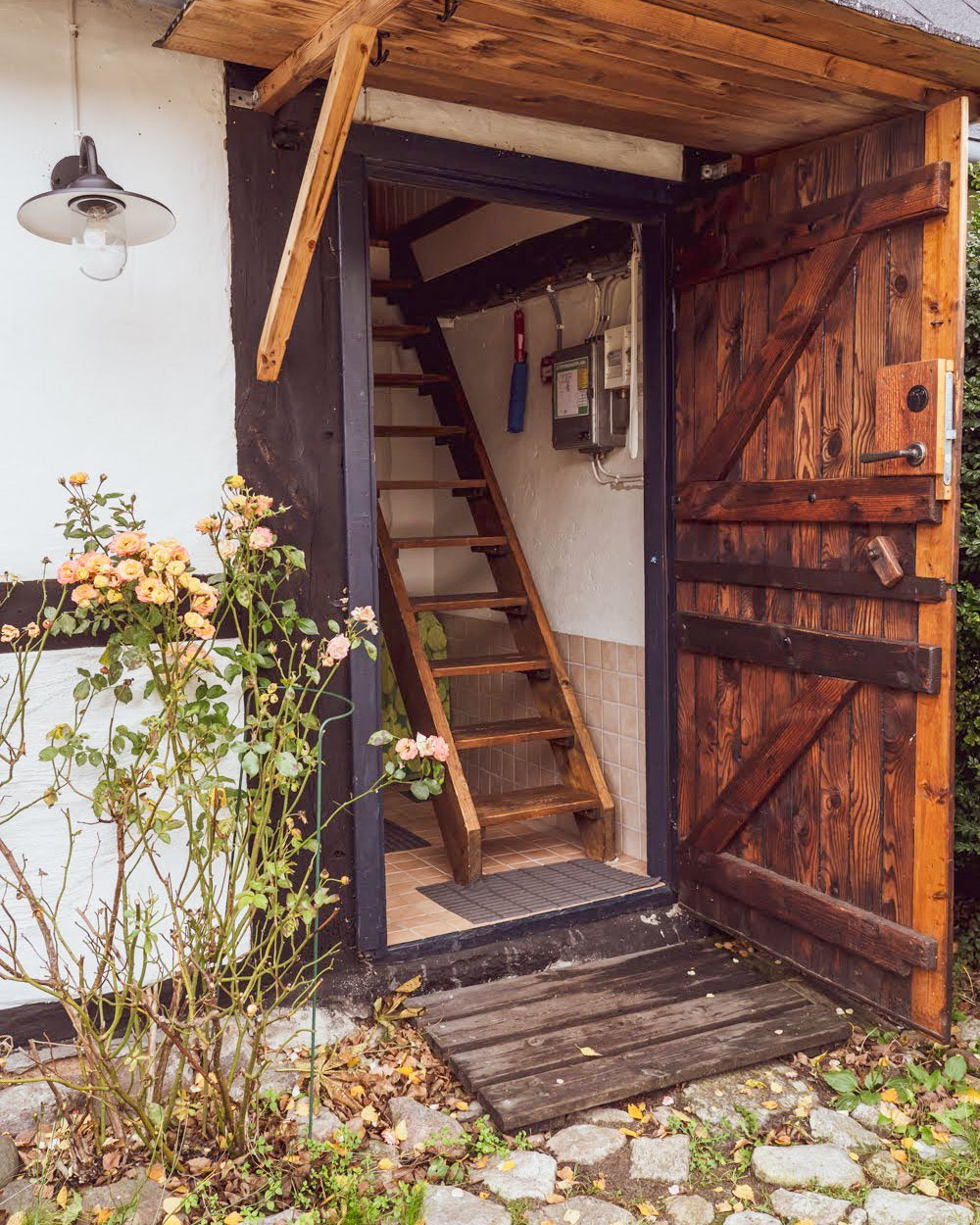 Open farm door and steep stairs.